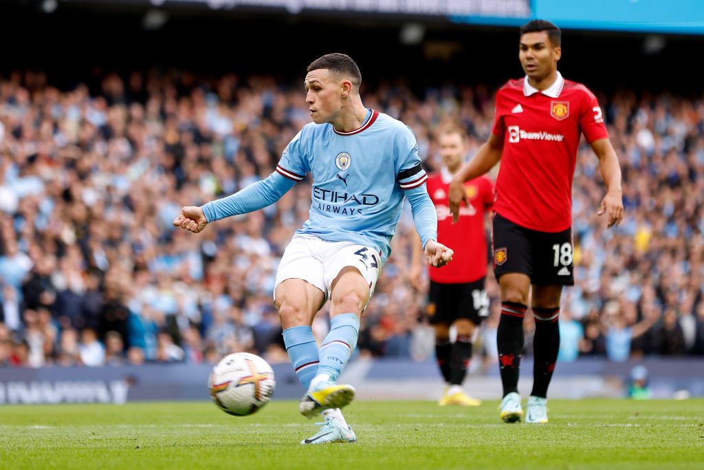 MANCHESTER, ENGLAND - OCTOBER 02: Phil Foden of Manchester City scores their sides sixth goal and their hat trick during the Premier League match between Manchester City and Manchester United at Etihad Stadium on October 02, 2022 in Manchester, England. (Photo by Lynne Cameron - Manchester City/Manchester City FC via Getty Images)