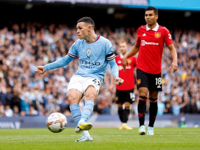 MANCHESTER, ENGLAND - OCTOBER 02: Phil Foden of Manchester City scores their sides sixth goal and their hat trick during the Premier League match between Manchester City and Manchester United at Etihad Stadium on October 02, 2022 in Manchester, England. (Photo by Lynne Cameron - Manchester City/Manchester City FC via Getty Images)