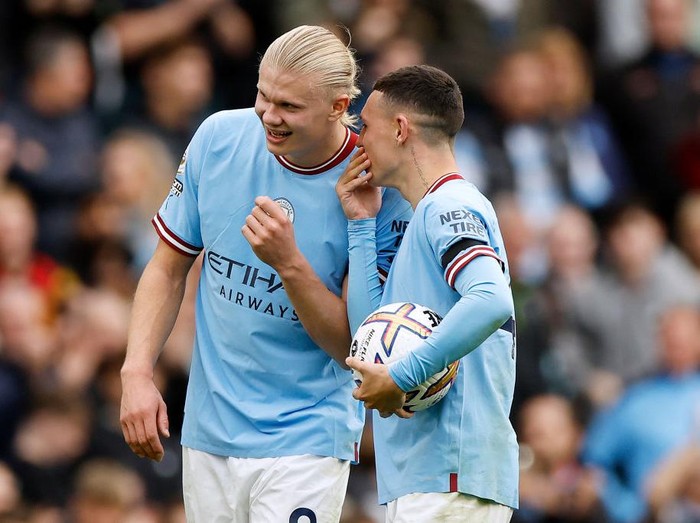 MANCHESTER, ENGLAND - OCTOBER 02: Erling Haaland and Phil Foden of Manchester City interact following the Premier League match between Manchester City and Manchester United at Etihad Stadium on October 02, 2022 in Manchester, England. (Photo by Lynne Cameron - Manchester City/Manchester City FC via Getty Images)