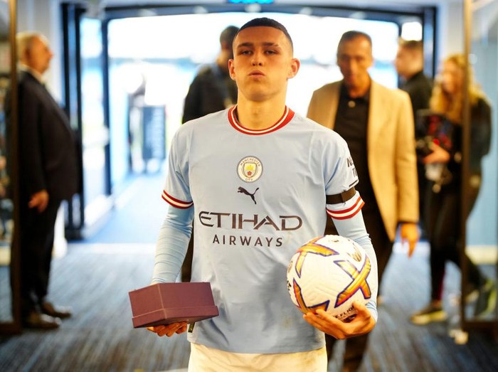 MANCHESTER, ENGLAND - OCTOBER 02: Phil Foden of Manchester City makes their way down the tunnel with the match ball after scoring a hat trick following the Premier League match between Manchester City and Manchester United at Etihad Stadium on October 02, 2022 in Manchester, England. (Photo by Tom Flathers/Manchester City FC via Getty Images)