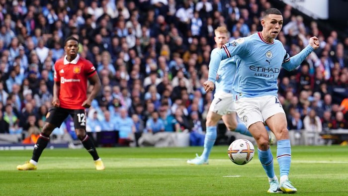 Phil Foden Vs MU Manchester City's Phil Foden (right) scores their side's first goal of the gameduring the Premier League match at the Etihad Stadium, Manchester. Picture date: Sunday October 2, 2022. (Photo by Martin Rickett/PA Images via Getty Images)