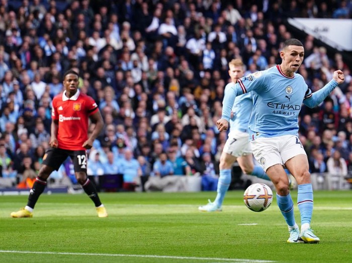 Manchester City's Phil Foden (right) scores their side's first goal of the gameduring the Premier League match at the Etihad Stadium, Manchester. Picture date: Sunday October 2, 2022. (Photo by Martin Rickett/PA Images via Getty Images)