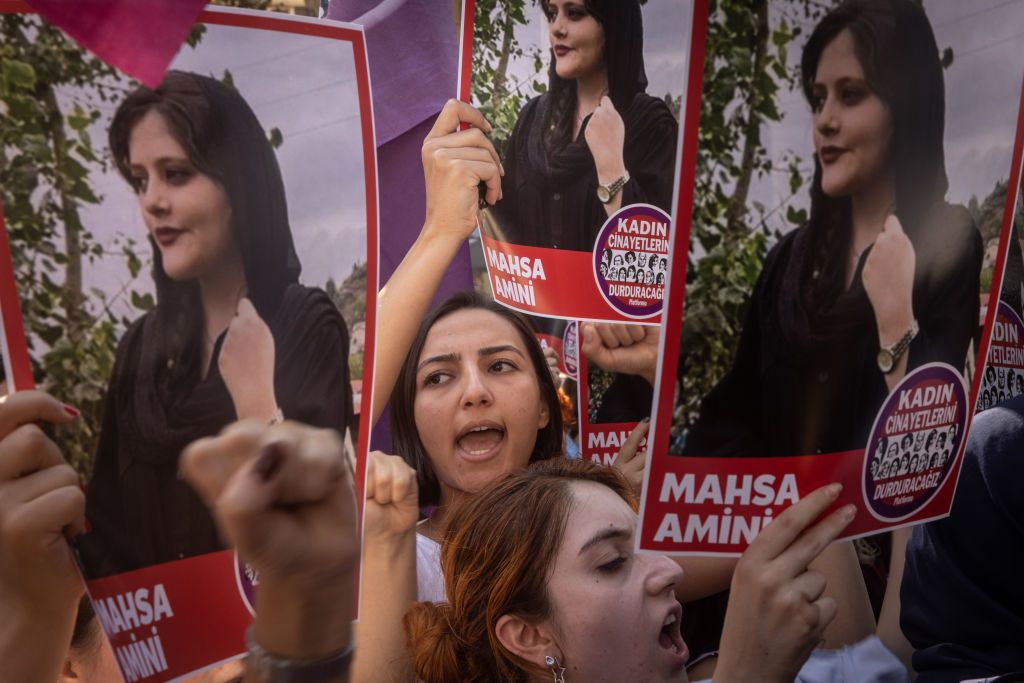 ISTANBUL, TURKEY - SEPTEMBER 29: Women hold signs and chant slogans during a protest over the death of Iranian Mahsa Amini outside the Iranian Consulate on September 29, 2022 in Istanbul, Turkey. Mahsa Amini fell into a coma and died after being arrested in Tehran by the morality police, for allegedly violating the countries hijab rules. Amini's death has sparked weeks of violent protests across Iran.  (Photo by Chris McGrath/Getty Images)