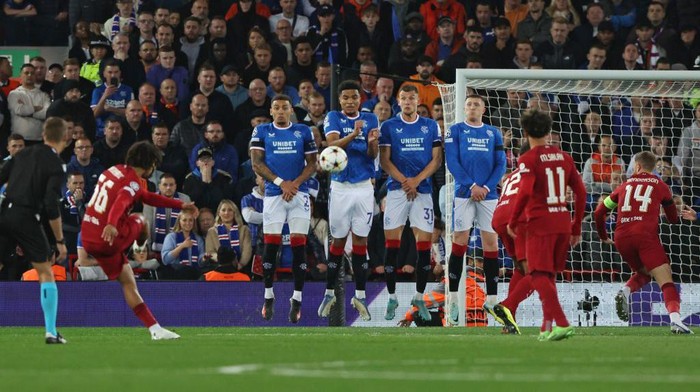 Liverpools English defender Trent Alexander-Arnold (2nd L) scores the opening goal from a free kick during UEFA Champions League group A football match between Liverpool and Glasgow Rangers at Anfield in Liverpool, north west England on October 4, 2022. (Photo by Nigel Roddis / AFP) (Photo by NIGEL RODDIS/AFP via Getty Images)