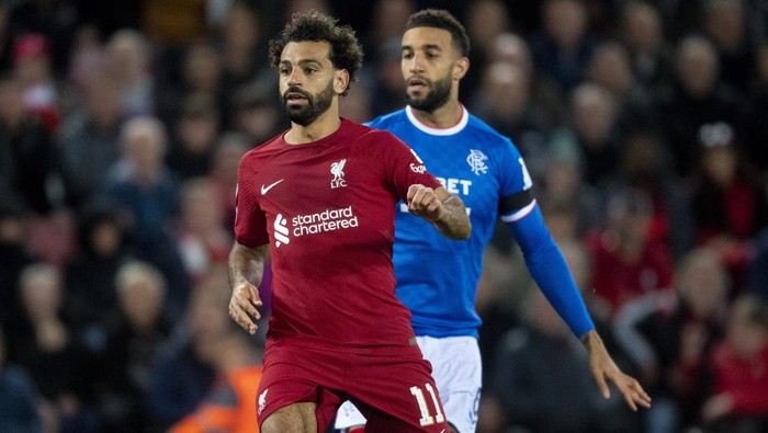 LIVERPOOL, ENGLAND - OCTOBER 04: Liverpools Mohamed Salah and Rangers Connor Goldson during a UEFA Champions League match between Liverpool and Rangers at Anfield, on October 04, 2022, in Liverpool, England. (Photo by Ross MacDonald/SNS Group via Getty Images)
