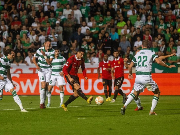 NICOSIA, CYPRUS - OCTOBER 06: Cristiano Ronaldo of Manchester United in action with Adam Lang of Omonia Nikosia during the UEFA Europa League group E match between Omonia Nikosia and Manchester United at GSP Stadium on October 06, 2022 in Nicosia, Cyprus. (Photo by Ash Donelon/Manchester United via Getty Images)