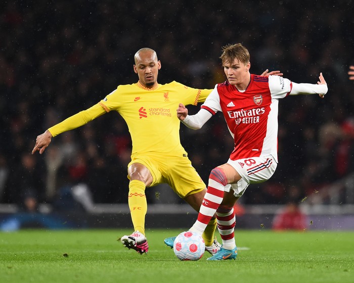 LONDON, ENGLAND - MARCH 16: ( THE SUN OUT,THE SUN ON SUNDAY OUT) Martin Odegaard of Arsenal with Fabinho of Liverpool during the Premier League match between Arsenal and Liverpool at Emirates Stadium on March 16, 2022 in London, England. (Photo by Andrew Powell/Liverpool FC via Getty Images)