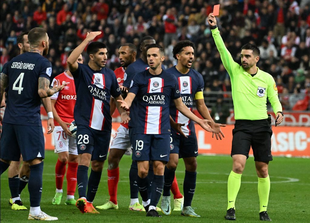 Reims' Moroccan defender Yunis Abdelhamid (L) fights for the ball with Paris Saint-Germain's French forward Kylian Mbappe and Reims' Ivorian defender Emmanuel Agbadou during the French L1 football match between Stade de Reims and Paris Saint-Germain (PSG) at Stade Auguste-Delaune in Reims, northern France on October 8, 2022. (Photo by DENIS CHARLET / AFP) (Photo by DENIS CHARLET/AFP via Getty Images)