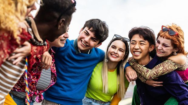 Happy young diverse friends having fun hanging out together - Youth people millennial generation concept