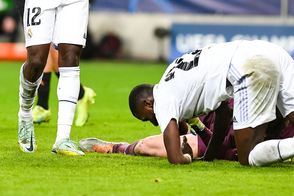 WARSAW, POLAND - OCTOBER 11: Antonio Rudiger of Real Madrid clashes with Anatoliy Trubin of Shakhtar Donetsk during the UEFA Champions League group F match between Shakhtar Donetsk and Real Madrid at Wojska Polskiego Stadium on October 11, 2022 in Warsaw, Poland. (Photo by Adam Nurkiewicz/Getty Images)