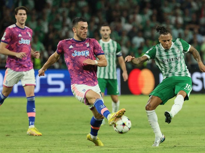 Juventus' Serbian midfielder Filip Kostic (C) blocks a shot by Maccabi Haifa's Surinamese midfielder Tjaronn Chery (R) during the UEFA Champions League group H football match between Israel's Maccabi Haifa and Italy's Juventus at the Sammy Ofer stadium in the city of Haifa on October 11, 2022. (Photo by JACK GUEZ / AFP) (Photo by JACK GUEZ/AFP via Getty Images)