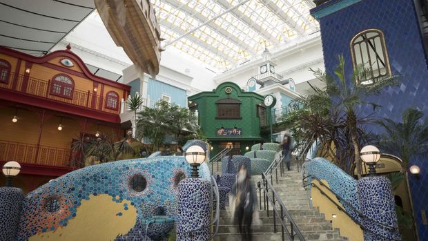 NAGAKUTE, JAPAN - OCTOBER 12: Guest attendees walk through the Ghibli's Grand Warehouse area, that is copyrighted by Studio Ghibli, during a preview for the Ghibli Park on October 12, 2022 in Nagakute, Japan. The theme park, which features Studio Ghibli animations, opens on November 1 in the Expo 2005 Aichi Commemorative Park. (Photo by Tomohiro Ohsumi/Getty Images)