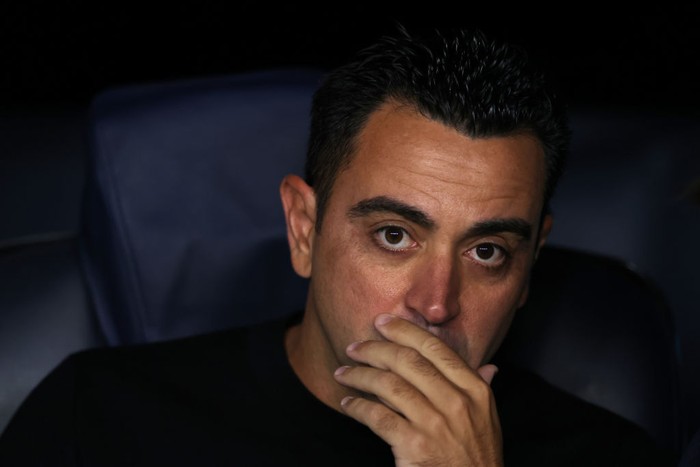 BARCELONA, SPAIN - OCTOBER 12: Xavi Hernandez Head coach of FC Barcelona reacts as he looks on from the bench prior to kick off in the UEFA Champions League group C match between FC Barcelona and FC Internazionale at Spotify Camp Nou on October 12, 2022 in Barcelona, Spain. (Photo by Jonathan Moscrop/Getty Images)