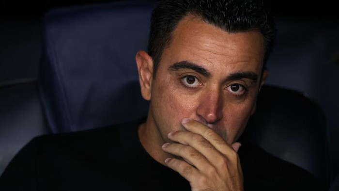 BARCELONA, SPAIN - OCTOBER 12: Xavi Hernandez Head coach of FC Barcelona reacts as he looks on from the bench prior to kick off in the UEFA Champions League group C match between FC Barcelona and FC Internazionale at Spotify Camp Nou on October 12, 2022 in Barcelona, Spain. (Photo by Jonathan Moscrop/Getty Images)