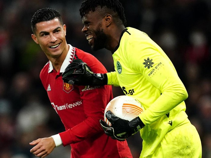 Manchester United's Cristiano Ronaldo with Omonia goalkeeper Francis Uzoho during the UEFA Europa League group E match at Old Trafford, Manchester. Picture date: Thursday October 13, 2022. (Photo by Martin Rickett/PA Images via Getty Images)