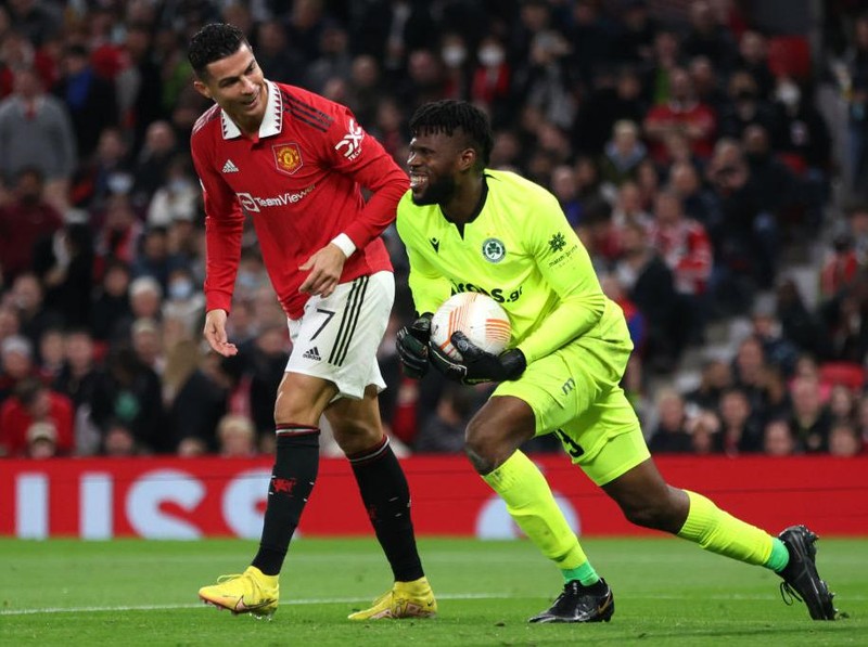 MANCHESTER, ENGLAND - OCTOBER 13: Cristiano Ronaldo of Manchester United speaks to Francis Uzoho of Omonia Nicosia  during the UEFA Europa League group E match between Manchester United and Omonia Nikosia at Old Trafford on October 13, 2022 in Manchester, England. (Photo by Clive Brunskill/Getty Images)