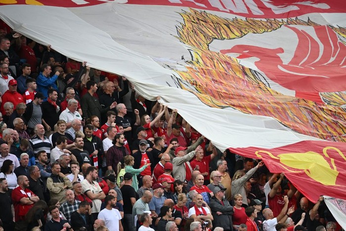 Liverpools fans pass a banner across the stands during the English Premier League football match between Liverpool and Crystal Palace at Anfield stadium, in Liverpool, north west England on August 15, 2022. - - RESTRICTED TO EDITORIAL USE. No use with unauthorized audio, video, data, fixture lists, club/league logos or live services. Online in-match use limited to 120 images. An additional 40 images may be used in extra time. No video emulation. Social media in-match use limited to 120 images. An additional 40 images may be used in extra time. No use in betting publications, games or single club/league/player publications. (Photo by Paul ELLIS / AFP) / RESTRICTED TO EDITORIAL USE. No use with unauthorized audio, video, data, fixture lists, club/league logos or live services. Online in-match use limited to 120 images. An additional 40 images may be used in extra time. No video emulation. Social media in-match use limited to 120 images. An additional 40 images may be used in extra time. No use in betting publications, games or single club/league/player publications. / RESTRICTED TO EDITORIAL USE. No use with unauthorized audio, video, data, fixture lists, club/league logos or live services. Online in-match use limited to 120 images. An additional 40 images may be used in extra time. No video emulation. Social media in-match use limited to 120 images. An additional 40 images may be used in extra time. No use in betting publications, games or single club/league/player publications. (Photo by PAUL ELLIS/AFP via Getty Images)