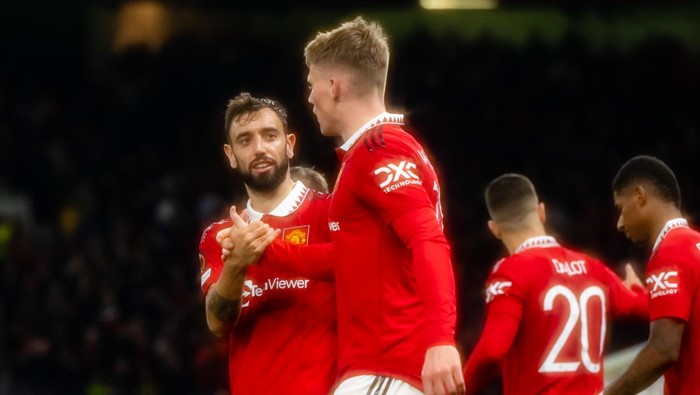 MANCHESTER, ENGLAND - OCTOBER 13:   Scott McTominay of Manchester United celebrates scoring a goal to make the score 1-0 with Bruno Fernandes during the UEFA Europa League group E match between Manchester United and Omonia Nicosia at Old Trafford on October 13, 2022 in Manchester, United Kingdom. (Photo by Ash Donelon/Manchester United via Getty Images)