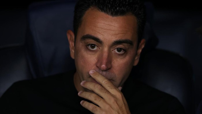 BARCELONA, SPAIN - OCTOBER 12: Xavi Hernandez Head coach of FC Barcelona reacts as he looks on from the bench prior to kick off in the UEFA Champions League group C match between FC Barcelona and FC Internazionale at Spotify Camp Nou on October 12, 2022 in Barcelona, Spain. (Photo by Jonathan Moscrop/Getty Images)