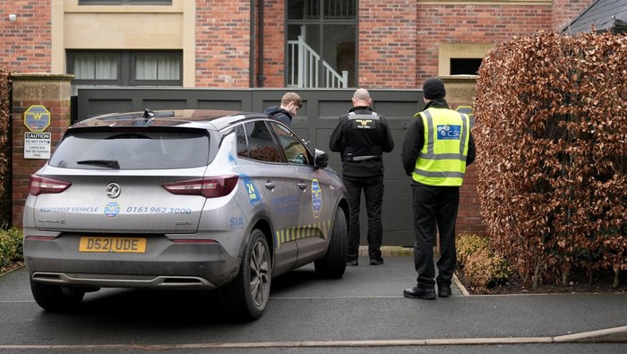ALTRINCHAM, ENGLAND - FEBRUARY 02: Security guards stand outside the house of Manchester Uniteds player Mason Greenwood on February 02, 2022 in Altrincham, England. The 20-year-old footballer has been released on bail after being arrested on Sunday after allegations appeared on social media. He is being questioned on suspicion of rape and sexual assault. Manchester United has said he will not return to training or matches until further notice. (Photo by Christopher Furlong/Getty Images)
