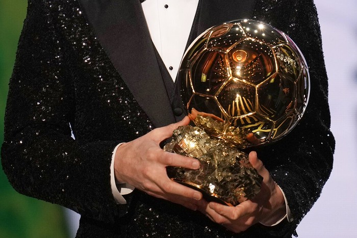 PSG player Lionel Messi holds the 2021 Ballon dOr trophy during the 65th Ballon dOr ceremony at Theatre du Chatelet, in Paris, Monday, Nov. 29, 2021. Messi won the Ballon dOr for seventh time. (AP Photo/Christophe Ena)