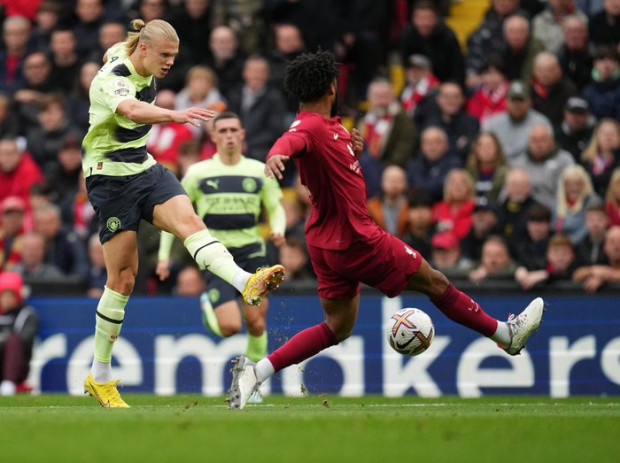 LIVERPOOL, ENGLAND - OCTOBER 16: Erling Haaland of Manchester City takes a shot during the Premier League match between Liverpool FC and Manchester City at Anfield on October 16, 2022 in Liverpool, England. (Photo by Matt McNulty - Manchester City/Manchester City FC via Getty Images)