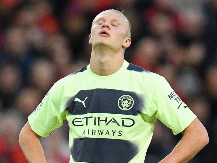 Manchester City's Norwegian striker Erling Haaland reacts during the English Premier League football match between Liverpool and Manchester City at Anfield in Liverpool, north west England on October 16, 2022. - - RESTRICTED TO EDITORIAL USE. No use with unauthorized audio, video, data, fixture lists, club/league logos or 'live' services. Online in-match use limited to 120 images. An additional 40 images may be used in extra time. No video emulation. Social media in-match use limited to 120 images. An additional 40 images may be used in extra time. No use in betting publications, games or single club/league/player publications. (Photo by Oli SCARFF / AFP) / RESTRICTED TO EDITORIAL USE. No use with unauthorized audio, video, data, fixture lists, club/league logos or 'live' services. Online in-match use limited to 120 images. An additional 40 images may be used in extra time. No video emulation. Social media in-match use limited to 120 images. An additional 40 images may be used in extra time. No use in betting publications, games or single club/league/player publications. / RESTRICTED TO EDITORIAL USE. No use with unauthorized audio, video, data, fixture lists, club/league logos or 'live' services. Online in-match use limited to 120 images. An additional 40 images may be used in extra time. No video emulation. Social media in-match use limited to 120 images. An additional 40 images may be used in extra time. No use in betting publications, games or single club/league/player publications. (Photo by OLI SCARFF/AFP via Getty Images)