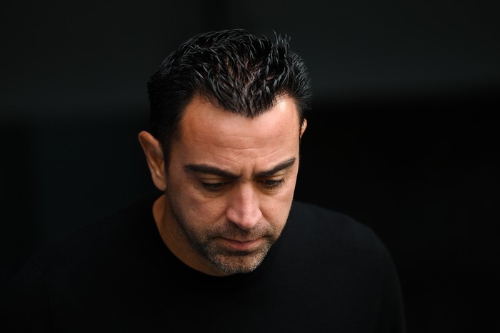MADRID, SPAIN - OCTOBER 16: Head coach Xavi Hernandez of FC Barcelona looks down prior to the LaLiga Santander match between Real Madrid CF and FC Barcelona at Estadio Santiago Bernabeu on October 16, 2022 in Madrid, Spain. (Photo by David Ramos/Getty Images)