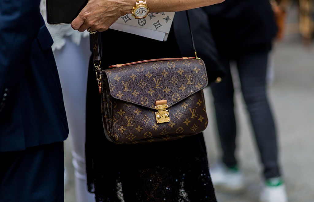 PARIS, FRANCE -  JUNE 23: A guest wearing a Louis Vuitton bag outside Louis Vuitton during the Paris Fashion Week Menswear Spring/Summer 2017 on June 23, 2016 in Paris, France.  (Photo by Christian Vierig/Getty Images)