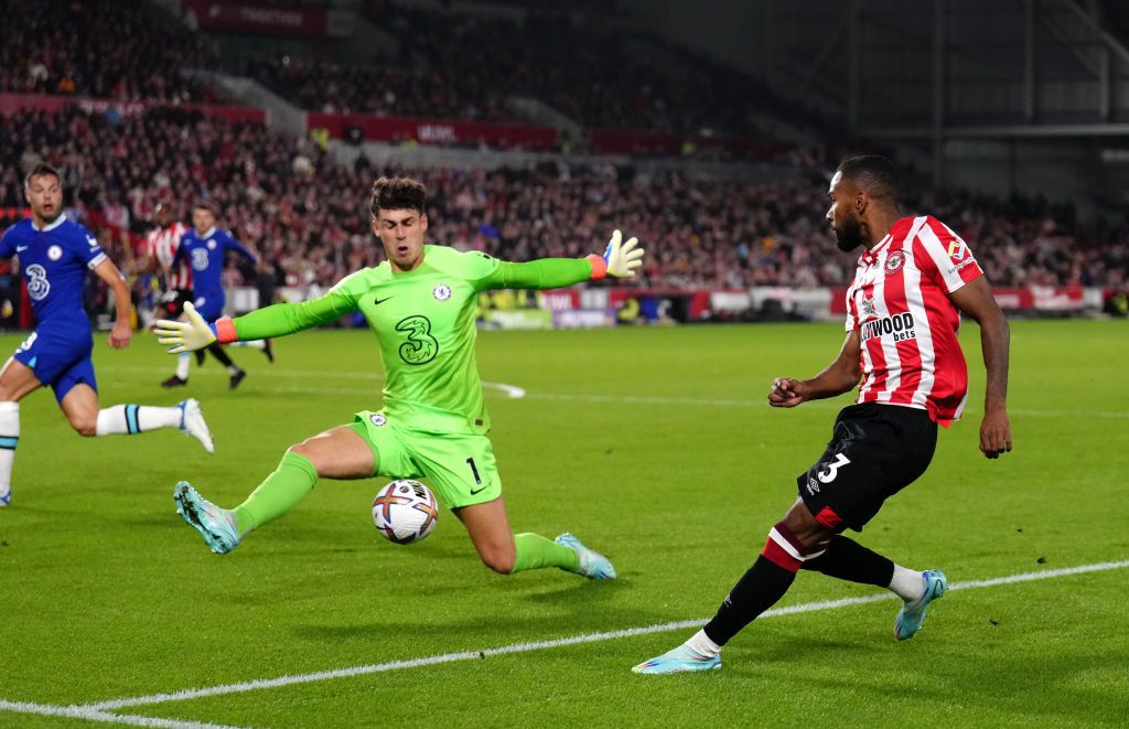Brentford's Rico Henry tries to beat Chelsea goalkeeper Kepa Arrizabalaga during the Premier League match at the Gtech Community Stadium, London. Picture date: Wednesday October 19, 2022. (Photo by John Walton/PA Images via Getty Images)