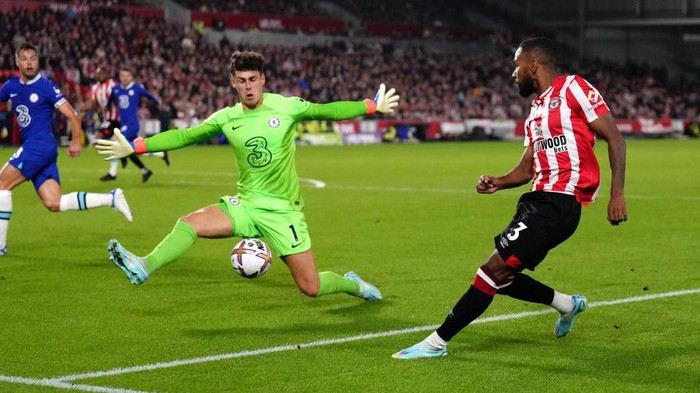 Brentfords Rico Henry tries to beat Chelsea goalkeeper Kepa Arrizabalaga during the Premier League match at the Gtech Community Stadium, London. Picture date: Wednesday October 19, 2022. (Photo by John Walton/PA Images via Getty Images)