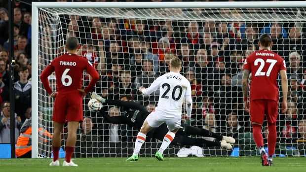 LIVERPOOL, ENGLAND - OCTOBER 19: Jarrod Bowen of West Ham United has a penalty saved by Alisson Becker of Liverpool during the Premier League match between Liverpool FC and West Ham United at Anfield on October 19, 2022 in Liverpool, England. (Photo by Michael Steele/Getty Images)