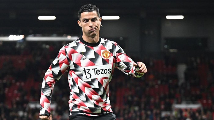 Manchester Uniteds Portuguese striker Cristiano Ronaldo reacts during the warm up prior to the English Premier League football match between Manchester United and Tottenham Hotspur at Old Trafford in Manchester, north west England, on October 19, 2022. - RESTRICTED TO EDITORIAL USE. No use with unauthorized audio, video, data, fixture lists, club/league logos or live services. Online in-match use limited to 120 images. An additional 40 images may be used in extra time. No video emulation. Social media in-match use limited to 120 images. An additional 40 images may be used in extra time. No use in betting publications, games or single club/league/player publications. (Photo by Oli SCARFF / AFP) / RESTRICTED TO EDITORIAL USE. No use with unauthorized audio, video, data, fixture lists, club/league logos or live services. Online in-match use limited to 120 images. An additional 40 images may be used in extra time. No video emulation. Social media in-match use limited to 120 images. An additional 40 images may be used in extra time. No use in betting publications, games or single club/league/player publications. / RESTRICTED TO EDITORIAL USE. No use with unauthorized audio, video, data, fixture lists, club/league logos or live services. Online in-match use limited to 120 images. An additional 40 images may be used in extra time. No video emulation. Social media in-match use limited to 120 images. An additional 40 images may be used in extra time. No use in betting publications, games or single club/league/player publications. (Photo by OLI SCARFF/AFP via Getty Images)