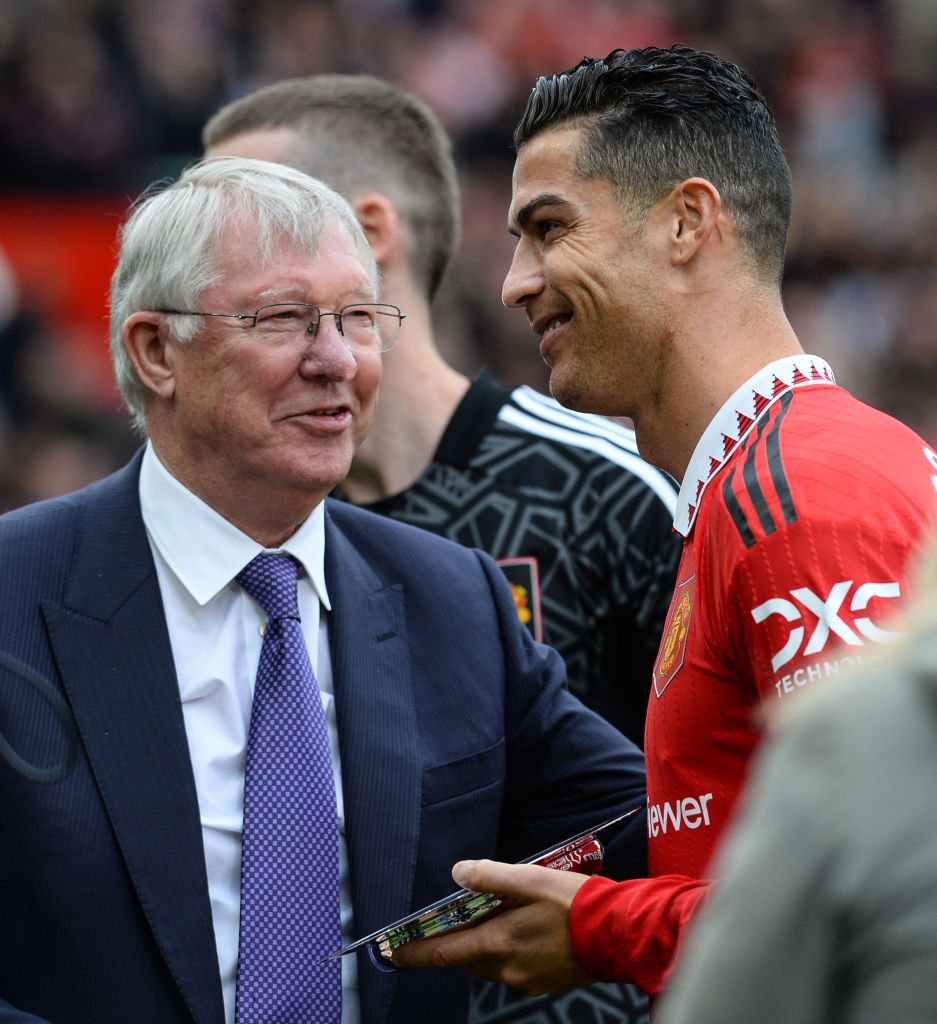 MANCHESTER, ENGLAND - OCTOBER 16: Cristiano Ronaldo of Manchester United (7) hands over an award to Sir Alex Ferguson during the Premier League match between Manchester United and Newcastle United at Old Trafford on October 16, 2022 in Manchester, England. (Photo by Serena Taylor/Newcastle United via Getty Images)