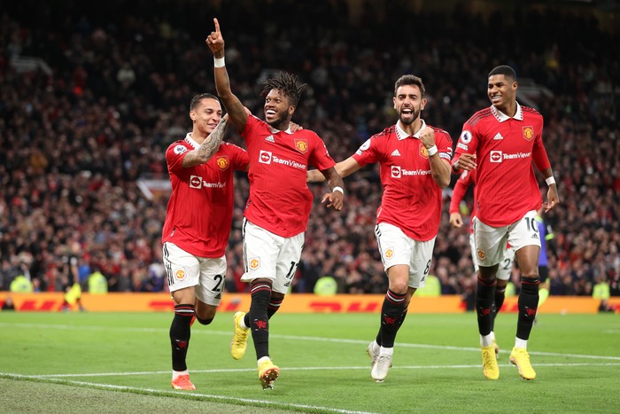 Manchester United MANCHESTER, ENGLAND - OCTOBER 19: Fred of Manchester United celebrates with team mates Antony, Bruno Fernandes and Marcus Rashford after scoring their sides first goal during the Premier League match between Manchester United and Tottenham Hotspur at Old Trafford on October 19, 2022 in Manchester, England. (Photo by Alex Pantling/Getty Images)
