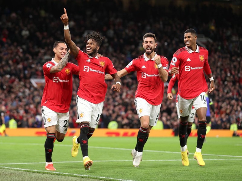 MANCHESTER, ENGLAND - OCTOBER 19: Fred of Manchester United celebrates with team mates Antony, Bruno Fernandes and Marcus Rashford after scoring their sides first goal during the Premier League match between Manchester United and Tottenham Hotspur at Old Trafford on October 19, 2022 in Manchester, England. (Photo by Alex Pantling/Getty Images)