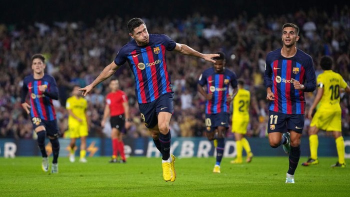 BARCELONA, SPAIN - OCTOBER 20: Robert Lewandowski of FC Barcelona celebrates after scoring their sides first goal during the LaLiga Santander match between FC Barcelona and Villarreal CF at Spotify Camp Nou on October 20, 2022 in Barcelona, Spain. (Photo by Alex Caparros/Getty Images)