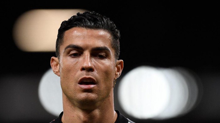 Manchester Uniteds Portuguese striker Cristiano Ronaldo reacts during the warm up prior to the English Premier League football match between Manchester United and Tottenham Hotspur at Old Trafford in Manchester, north west England, on October 19, 2022. - RESTRICTED TO EDITORIAL USE. No use with unauthorized audio, video, data, fixture lists, club/league logos or live services. Online in-match use limited to 120 images. An additional 40 images may be used in extra time. No video emulation. Social media in-match use limited to 120 images. An additional 40 images may be used in extra time. No use in betting publications, games or single club/league/player publications. (Photo by Oli SCARFF / AFP) / RESTRICTED TO EDITORIAL USE. No use with unauthorized audio, video, data, fixture lists, club/league logos or live services. Online in-match use limited to 120 images. An additional 40 images may be used in extra time. No video emulation. Social media in-match use limited to 120 images. An additional 40 images may be used in extra time. No use in betting publications, games or single club/league/player publications. / RESTRICTED TO EDITORIAL USE. No use with unauthorized audio, video, data, fixture lists, club/league logos or live services. Online in-match use limited to 120 images. An additional 40 images may be used in extra time. No video emulation. Social media in-match use limited to 120 images. An additional 40 images may be used in extra time. No use in betting publications, games or single club/league/player publications. (Photo by OLI SCARFF/AFP via Getty Images)