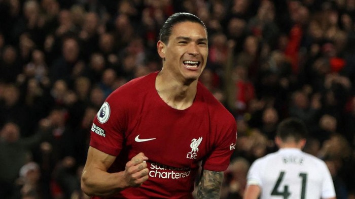 TOPSHOT - Liverpools Uruguayan striker Darwin Nunez celebrates after scoring the opening goal of the English Premier League football match between Liverpool and West Ham United at Anfield in Liverpool, north-west England on October 19, 2022. - - RESTRICTED TO EDITORIAL USE. No use with unauthorized audio, video, data, fixture lists, club/league logos or live services. Online in-match use limited to 120 images. An additional 40 images may be used in extra time. No video emulation. Social media in-match use limited to 120 images. An additional 40 images may be used in extra time. No use in betting publications, games or single club/league/player publications. (Photo by Nigel Roddis / AFP) / RESTRICTED TO EDITORIAL USE. No use with unauthorized audio, video, data, fixture lists, club/league logos or live services. Online in-match use limited to 120 images. An additional 40 images may be used in extra time. No video emulation. Social media in-match use limited to 120 images. An additional 40 images may be used in extra time. No use in betting publications, games or single club/league/player publications. / RESTRICTED TO EDITORIAL USE. No use with unauthorized audio, video, data, fixture lists, club/league logos or live services. Online in-match use limited to 120 images. An additional 40 images may be used in extra time. No video emulation. Social media in-match use limited to 120 images. An additional 40 images may be used in extra time. No use in betting publications, games or single club/league/player publications. (Photo by NIGEL RODDIS/AFP via Getty Images)