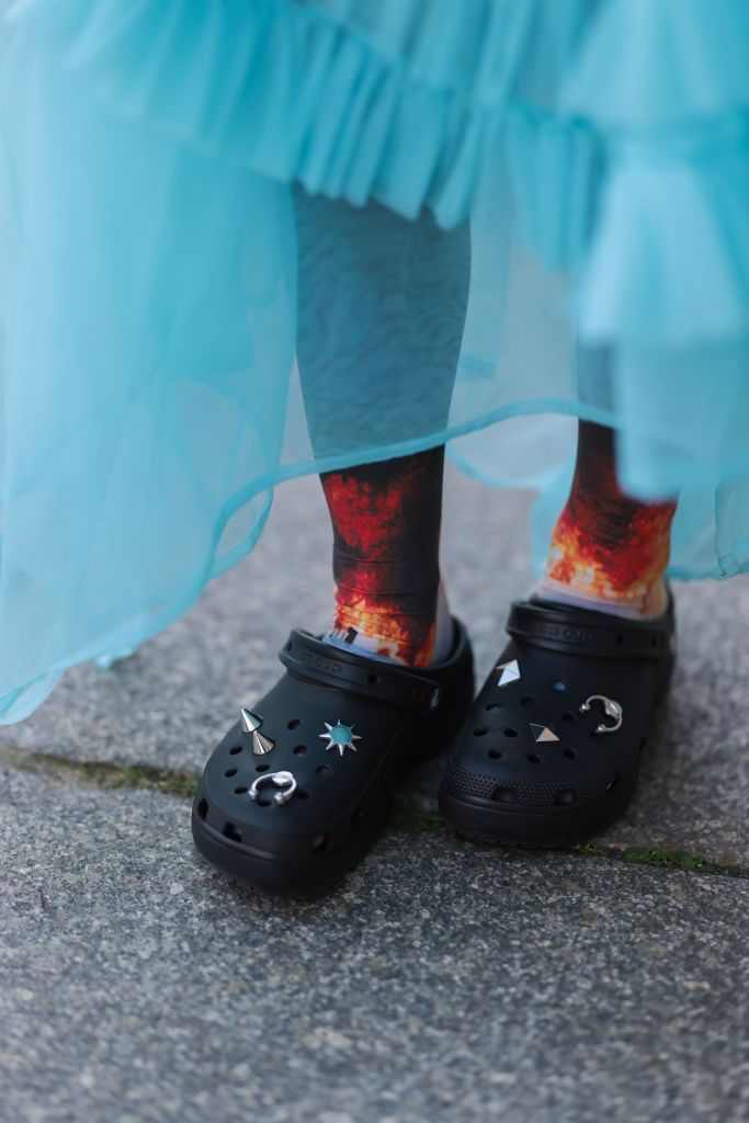 BERLIN, GERMANY - SEPTEMBER 07: Alina Kossan is seen wearing colorful socks and black Crocs clogs with colorful Jibbitz, during Berlin Fashion Week Spring/Summer 2023, on September 07, 2022 in Berlin. (Photo by Jeremy Moeller/Getty Images)