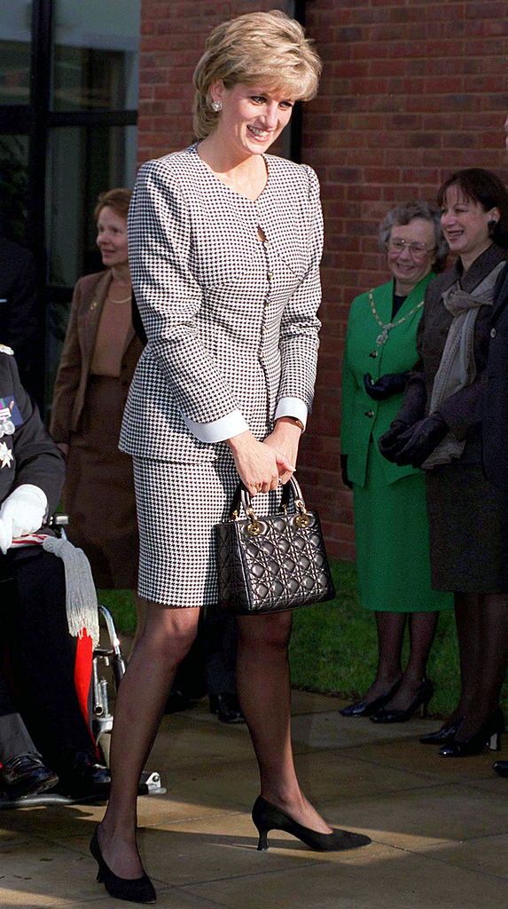 BIRMINGHAM, UNITED KINGDOM - OCTOBER 31:  Princess Diana, Patron, Opening The National Institute Of Conductive Education At Cannon Hill House, Russell Road, Moseley, Birmingham.  The Princess Is Wearing A Black And White Houndstooth Check Suit And She Is Carrying A Christian Dior Black Handbag.  (Photo by Tim Graham Photo Library via Getty Images)
