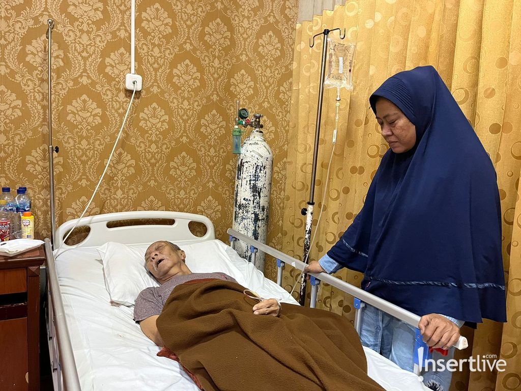 Pak Ogah yang didampingi sang istri
