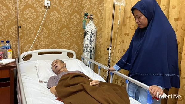 Pak Ogah yang didampingi sang istri