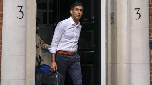 Conservative Party leadership candidate Rishi Sunak leaves his campaign office, in London, Sunday, Oct. 23, 2022. Former British Treasury chief Rishi Sunak is frontrunner in the Conservative Party's race to replace Liz Truss as prime minister. He has garnered support from over 100 Tory lawmakers to forge ahead of his two main rivals: ousted former Prime Minister Boris Johnson and ex-Cabinet minister Penny Mordaunt. But widespread uncertainty remained after British media reported that Sunak held late-night talks with Johnson on Saturday. (AP Photo/Alberto Pezzali)
