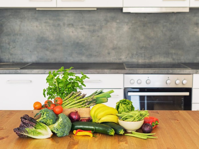 Fresh farm fruit and vegetables for masakan penurun kolesterol at kitchen counter