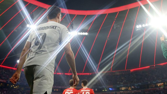 MUNICH, GERMANY - SEPTEMBER 13: (EDITORS NOTE: A special star effects camera filter was used for this image.) Robert Lewandowski of Barcelona enters the field of play with Thomas Müller of München and his team mate Noussair Mazraoui for the UEFA Champions League group C match between FC Bayern München and FC Barcelona at Allianz Arena on September 13, 2022 in Munich, Germany. (Photo by Alexander Hassenstein - UEFA/UEFA via Getty Images)