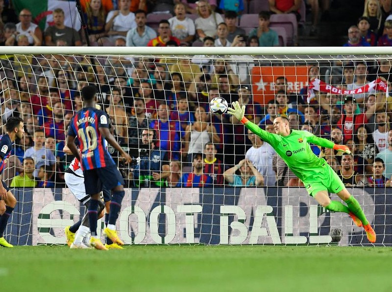 Barcelona's German goalkeeper Marc-Andre ter Stegen (R) fails to stop an offside shot from Rayo Vallecano's Colombian forward Radamel Falcao during the Spanish league football match between FC Barcelona and Rayo Vallecano de Madrid at the Camp Nou stadium in Barcelona on August 13, 2022. (Photo by Pau BARRENA / AFP) (Photo by PAU BARRENA/AFP via Getty Images)