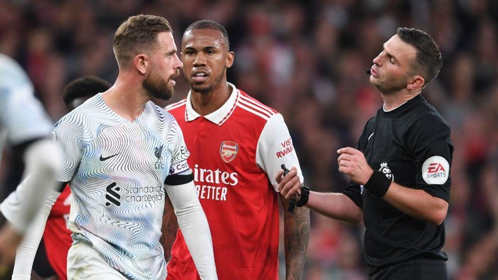 LONDON, ENGLAND - OCTOBER 09: Arsenals Gabriel clashes with Liverpools Jordan Henderson during the Premier League match between Arsenal FC and Liverpool FC at Emirates Stadium on October 09, 2022 in London, England. (Photo by Stuart MacFarlane/Arsenal FC via Getty Images)