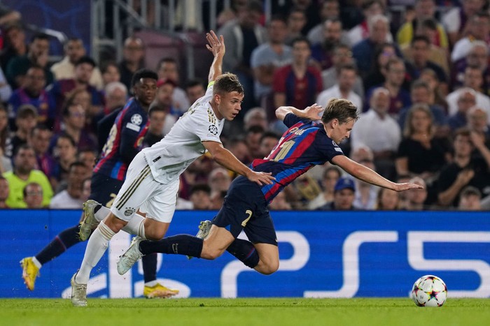 Frenkie de Jong central midfield of Barcelona and Netherlands and Joshua Kimmich defensive midfield of Bayern Munich and Germany compete for the ball during the UEFA Champions League group C match between FC Barcelona and FC Bayern München at Spotify Camp Nou on October 26, 2022 in Barcelona, Spain. (Photo by Jose Breton/Pics Action/NurPhoto via Getty Images)