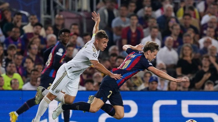 Frenkie de Jong central midfield of Barcelona and Netherlands and Joshua Kimmich defensive midfield of Bayern Munich and Germany compete for the ball during the UEFA Champions League group C match between FC Barcelona and FC Bayern München at Spotify Camp Nou on October 26, 2022 in Barcelona, Spain. (Photo by Jose Breton/Pics Action/NurPhoto via Getty Images)